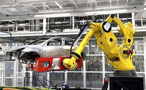Использует ли Tesla роботы Fanuc?